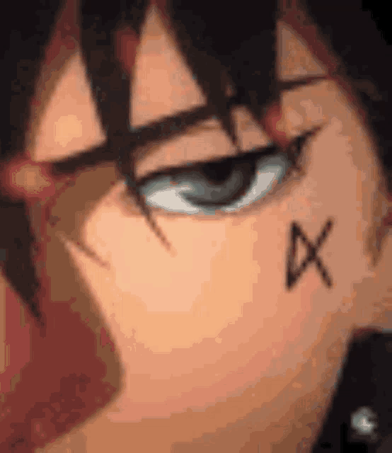 a close up of a person 's face with a cross on their face .