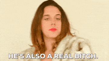 a woman wearing a fur coat is saying `` he 's also a real bitch . ''