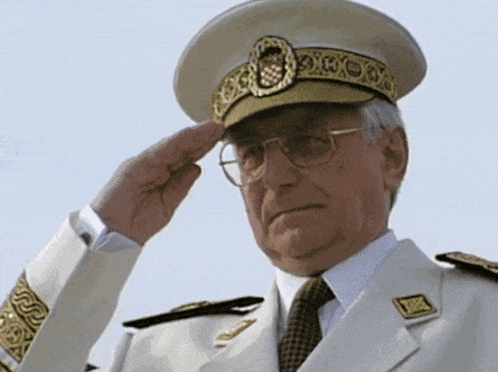 a man in a military uniform is saluting