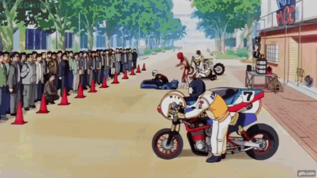 a man on a motorcycle with the number 7 on the side