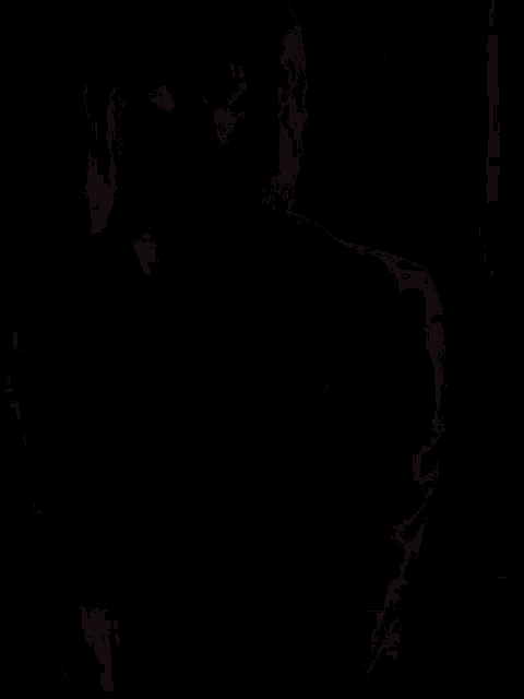 a man in a suit and tie is holding a sword in the dark