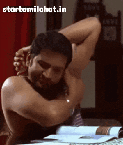a man without a shirt is hugging another man with the website starttamilchat.in visible in the corner