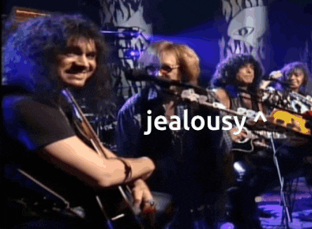 a group of men are playing guitars and singing into microphones with the word jealousy above them