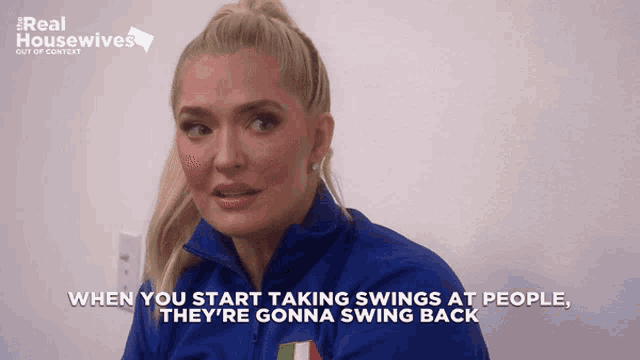 a woman in a blue jacket says when you start taking swings at people they re gonna swing back