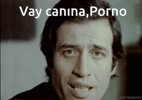 a close up of a man 's face with the words " vay canina porno " written on it