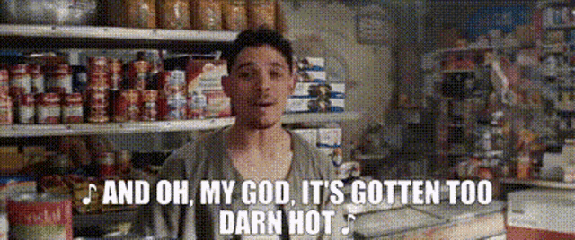 a man is standing in front of a grocery store shelf with the words and oh my god it 's gotten too darn hot
