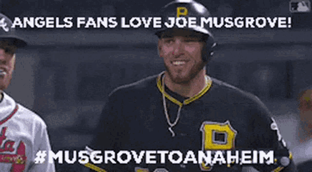 a baseball player wearing a black jersey with a yellow p on it