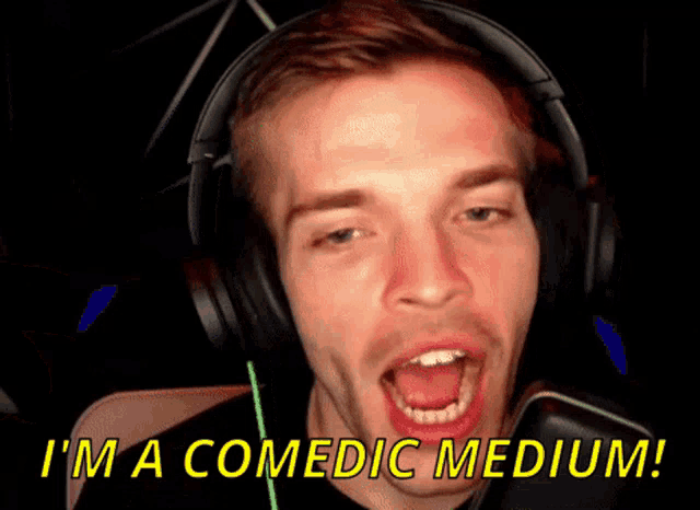 a man wearing headphones says " i 'm a comedic medium ! "