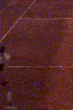 a blurry picture of a person running on a track .