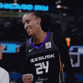 a female basketball player wearing a jersey with the number 24