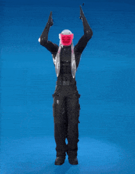 a man with a pink mask on his head stands with his arms outstretched