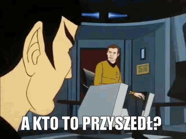 a cartoon of a man sitting at a desk with the words a kto to przyszedł written on it .