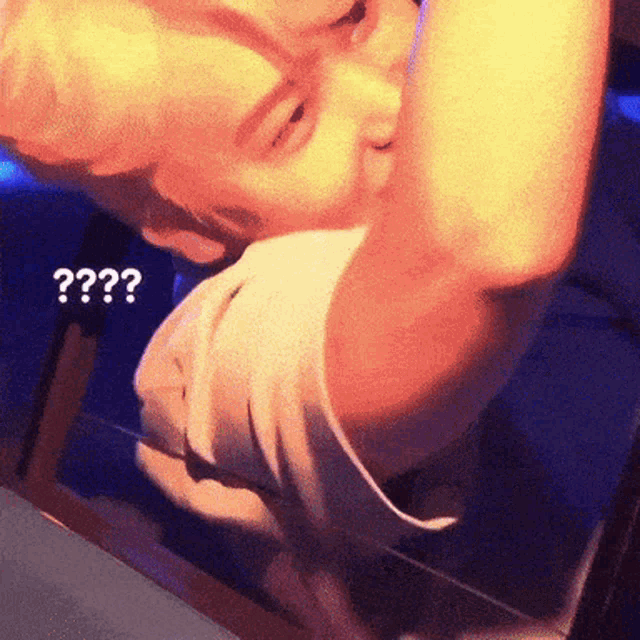 a person is looking at a mirror with a question mark above them
