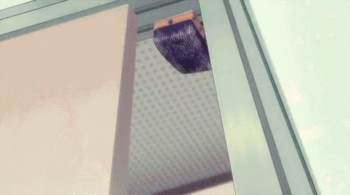 a purple light is hanging from the ceiling of a room