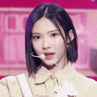 a woman with a microphone in her mouth