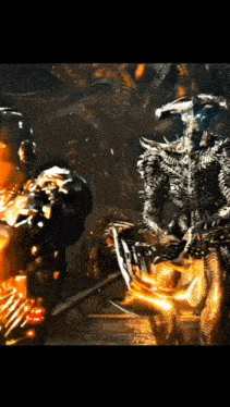 a group of monsters are standing in a dark room .