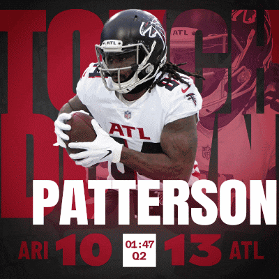 a football player named patterson is holding a football