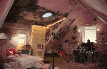 a girl 's bedroom with a drum set and a tv