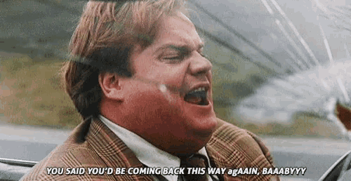a man in a suit and tie is screaming and saying you said you 'd be coming back this way again