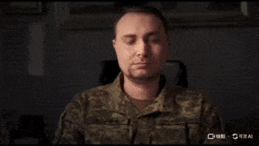 a man in a military uniform puts on sunglasses