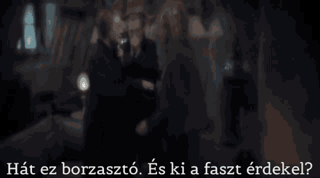 a blurry picture of three men with the words " hat ez borzaszto " in the upper left corner