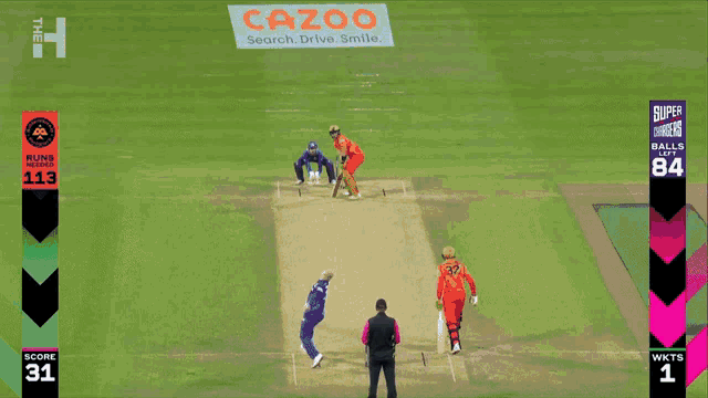 a cricket game is being played on a field with an ad for cazoo