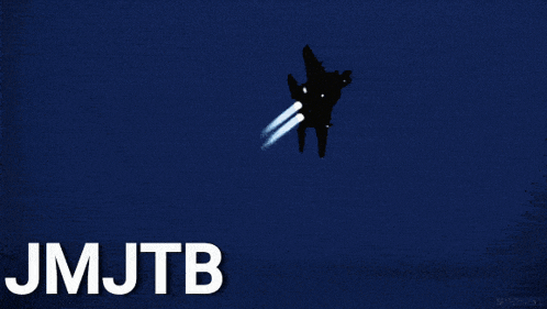 a fighter jet is flying in the dark with the words jmjtb above it