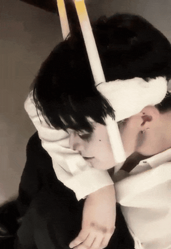 a person with a bandage on their head and a cigarette in their mouth