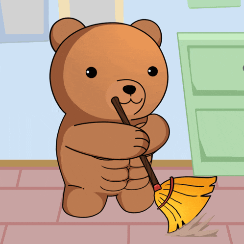 a teddy bear is sweeping the floor with a yellow broom