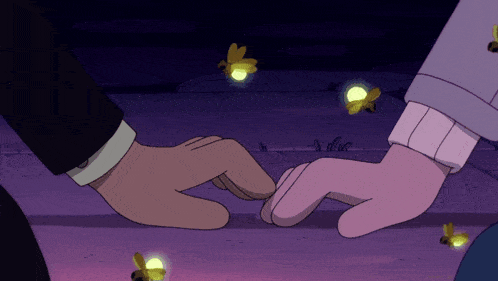 a man and a woman holding hands with fireflies flying around them