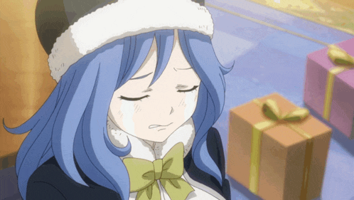 a girl with blue hair is wearing a santa hat and a bow tie