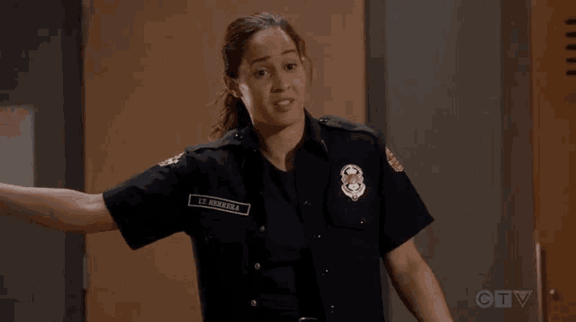 a woman in a police uniform has the name lee hernandez on her badge