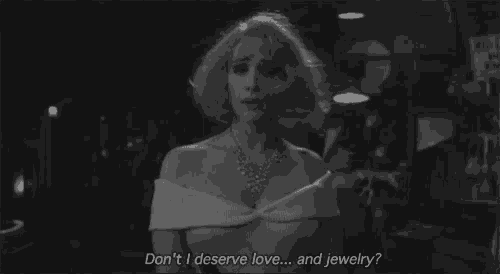a woman in a white dress says " don t i deserve love ... and jewelry "