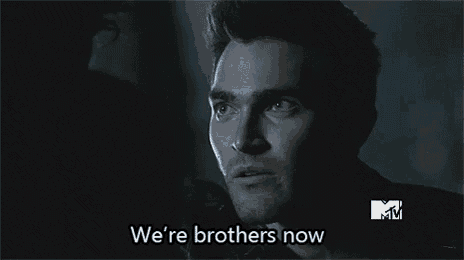 a close up of a man 's face with the words `` we 're brothers now '' .