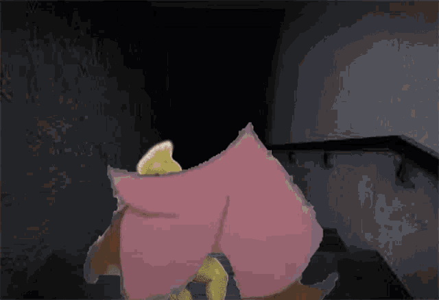 a cartoon character with a pink cape standing in a dark hallway