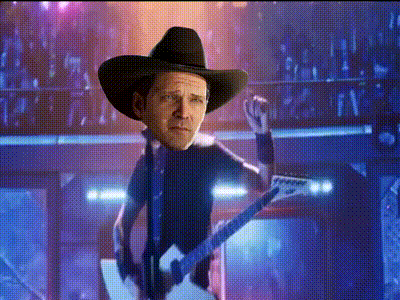 a man in a cowboy hat playing a guitar