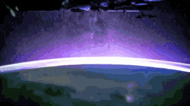 a pixelated image of the earth with a purple sky