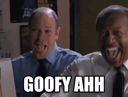 two men are sitting in front of a computer and one of them is making a funny face and the other is saying goofy ahh