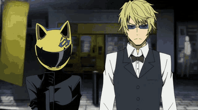 a man wearing sunglasses and a cat mask stands next to a man in a suit