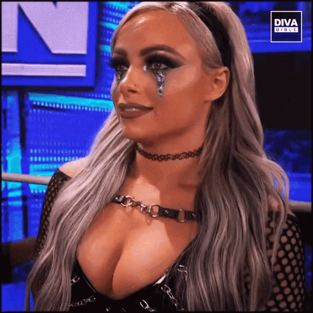 a woman with a choker and a diva circle logo on the bottom right