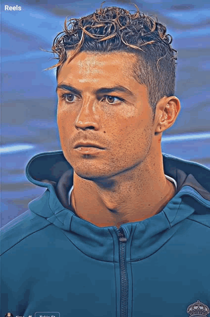 a man with curly hair is wearing a blue jacket with the word reels on the bottom