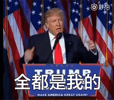 donald trump is giving a speech in front of an american flag and a sign that says make america great again