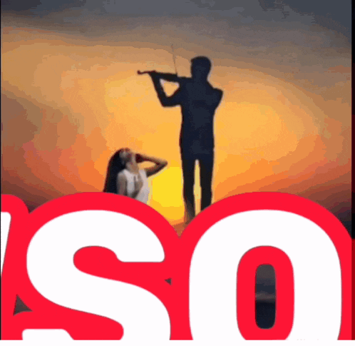 a silhouette of a man playing a violin with a woman in the background