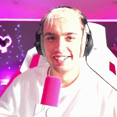 a man wearing headphones is sitting in a chair with a pink microphone .