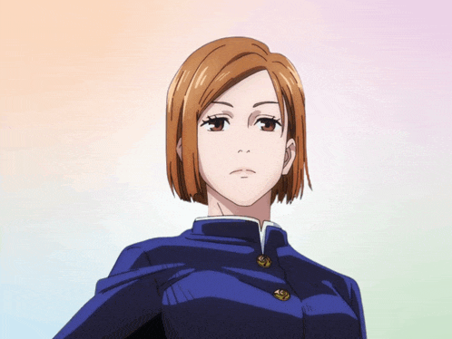 a girl with short brown hair is wearing a school uniform