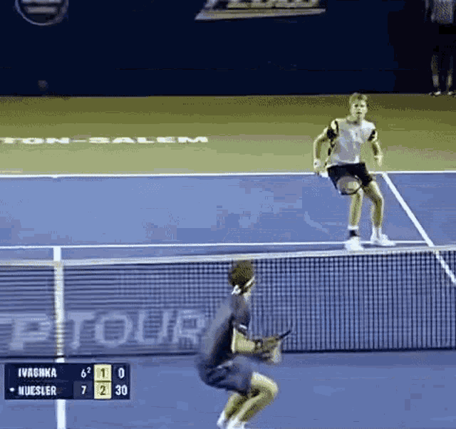 a tennis match between ivanka and nuesler is being played