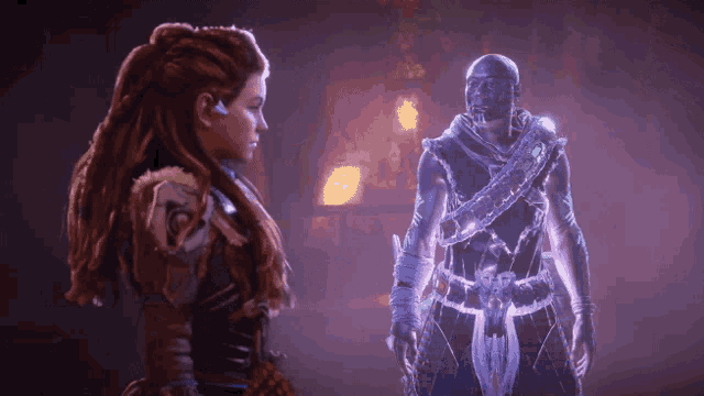 a man and a woman are standing next to each other in a dark room
