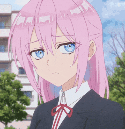 a girl with pink hair and blue eyes looks sad