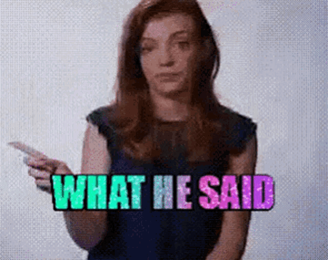 a woman is holding a cell phone with the words what he said behind her