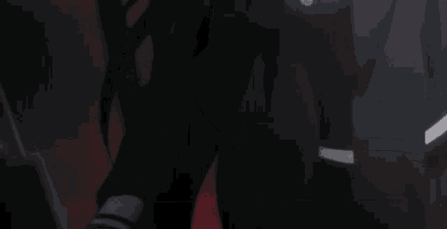 a person is typing on a laptop in the dark
